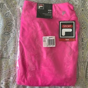 Women’s NWT Fila golf skirt, in pkg size medium. Smoke free pet free home.